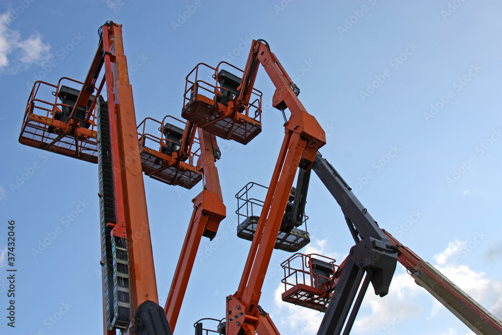 A Collection of Orange and Blue Cherry Pickers. A Collection of Orange and Blue Cherry Pickers.
