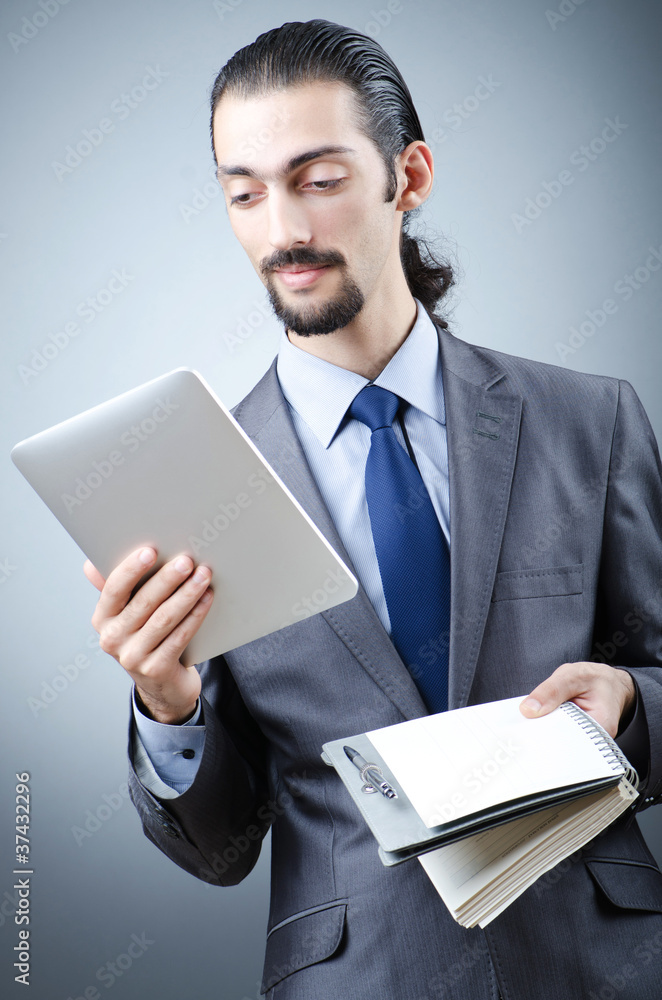 Businessman working on tablet computer Businessman working on tablet computer