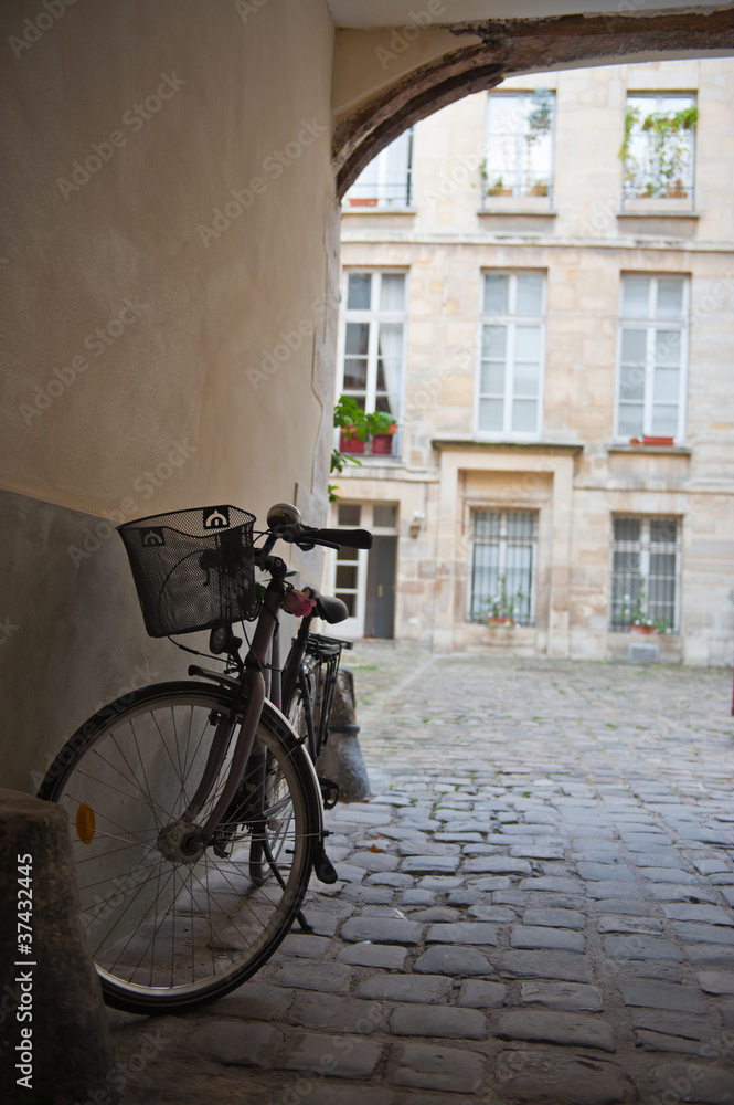 Retro bicycle in Parisian courtyard