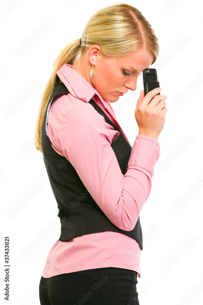 Sad business woman holding mobile near forehead Sad business woman holding mobile near forehead