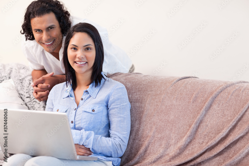 Couple on the sofa surfing the internet Couple on the sofa surfing the internet