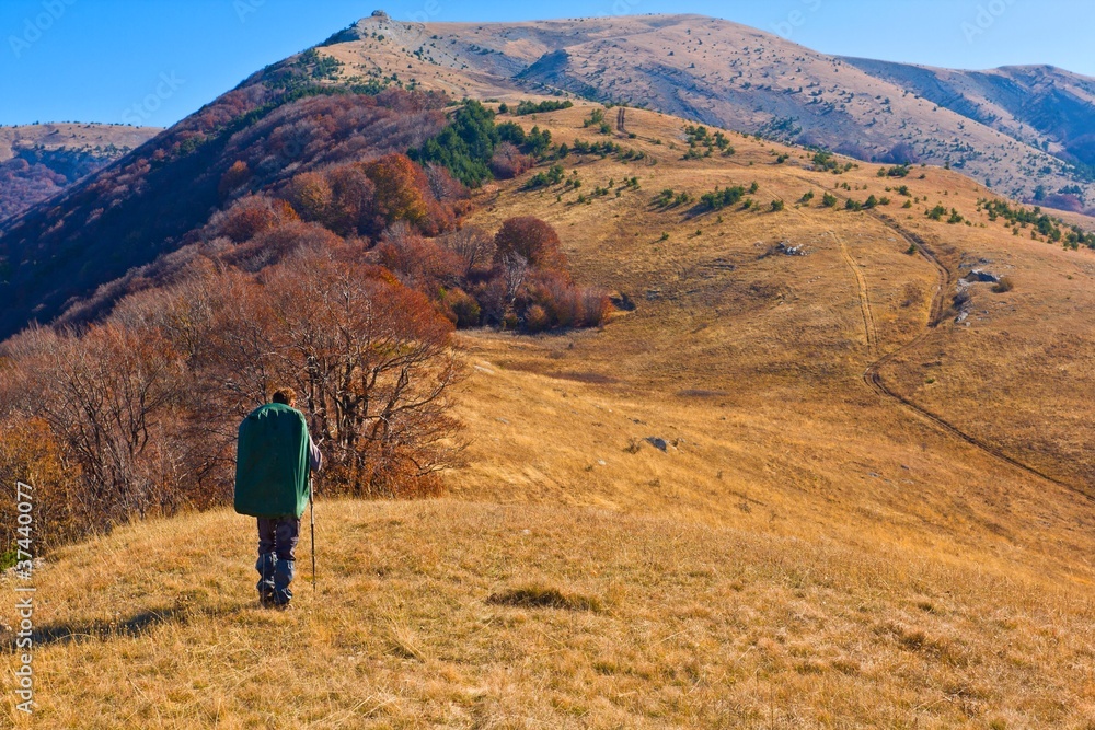 hiker in a autumn mountains