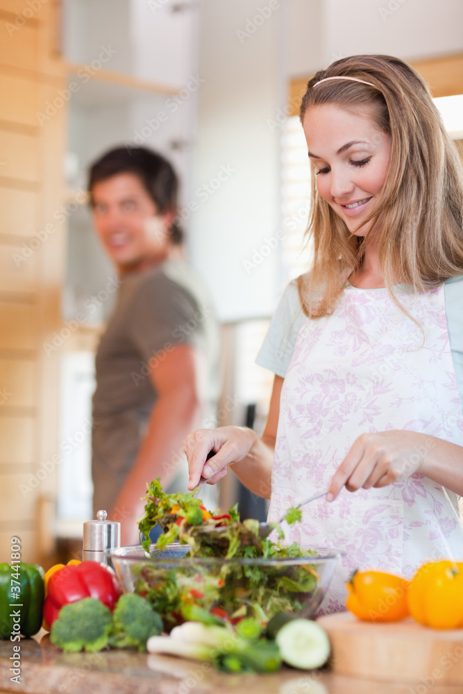 Portrait of a lovely couple making a salad Portrait of a lovely couple making a salad