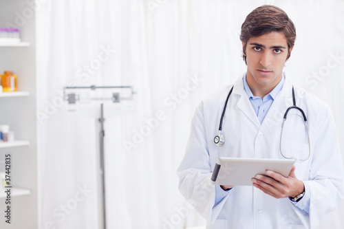Doctor with his tablet pc