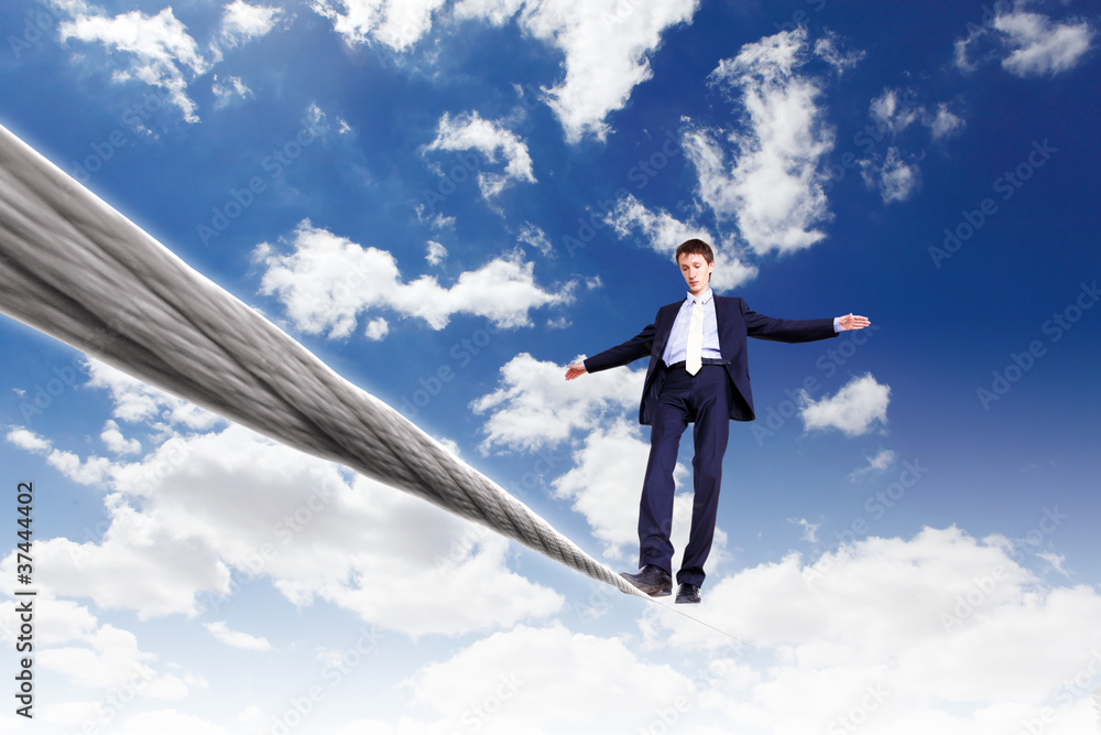 Business man balancing on the rope Business man balancing on the rope