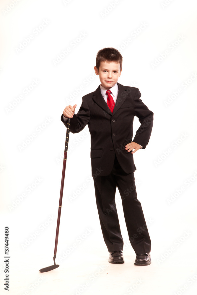 Boy in official dresscode with a golf club Boy in official dresscode with a golf club