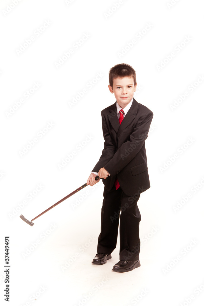 Boy in official dresscode with a golf club