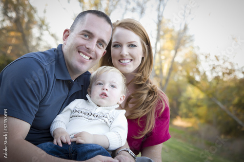 Young Attractive Parents and Child Portrait Outside