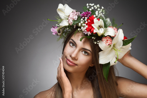 Beautiful woman with flower wreath. Space for text. © yuriyzhuravov