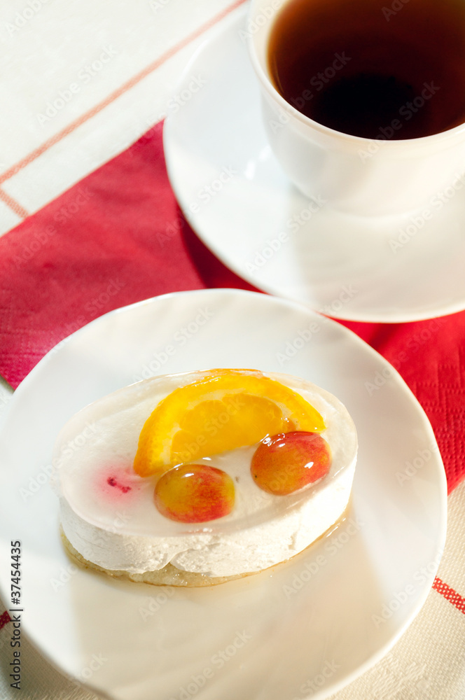 Delicious cake with fresh fruit and tea Delicious cake with fresh fruit and tea