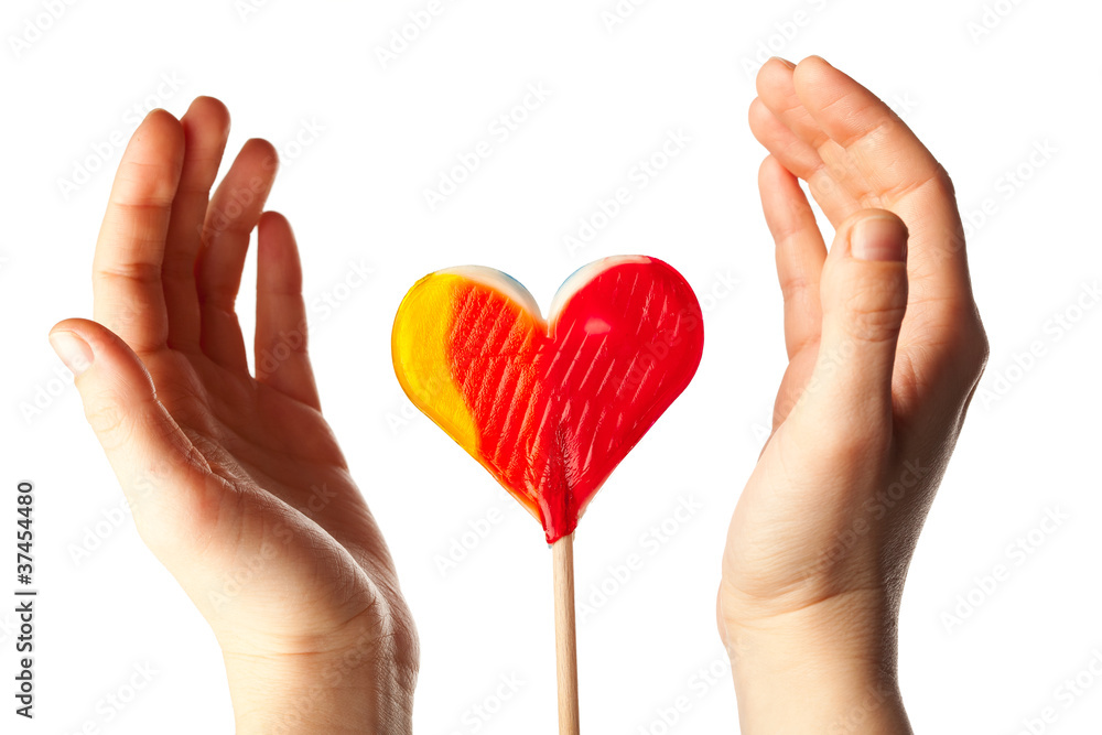 hands surrounding lollipop heart hands surrounding lollipop heart