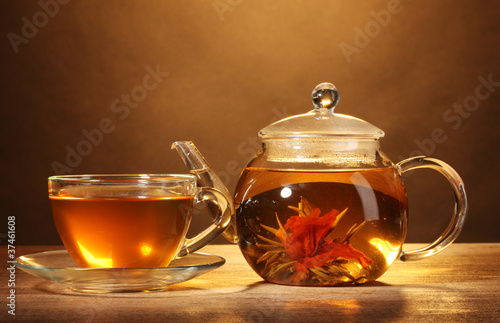 glass teapot and cup with exotic green tea