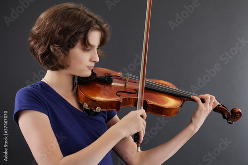Young female playing the violin