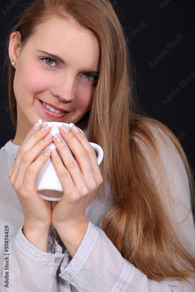 Woman drinking a hot drink