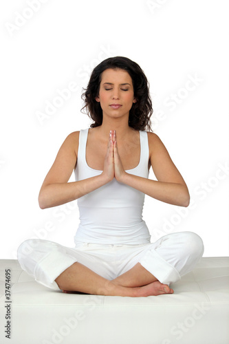 Woman sitting in yoga position