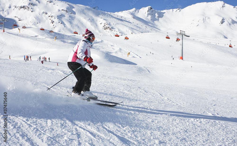 The woman is skiing at a ski resort Solden