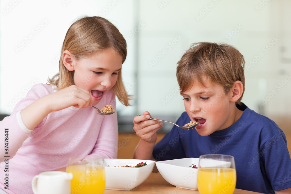 Young children having breakfast Young children having breakfast