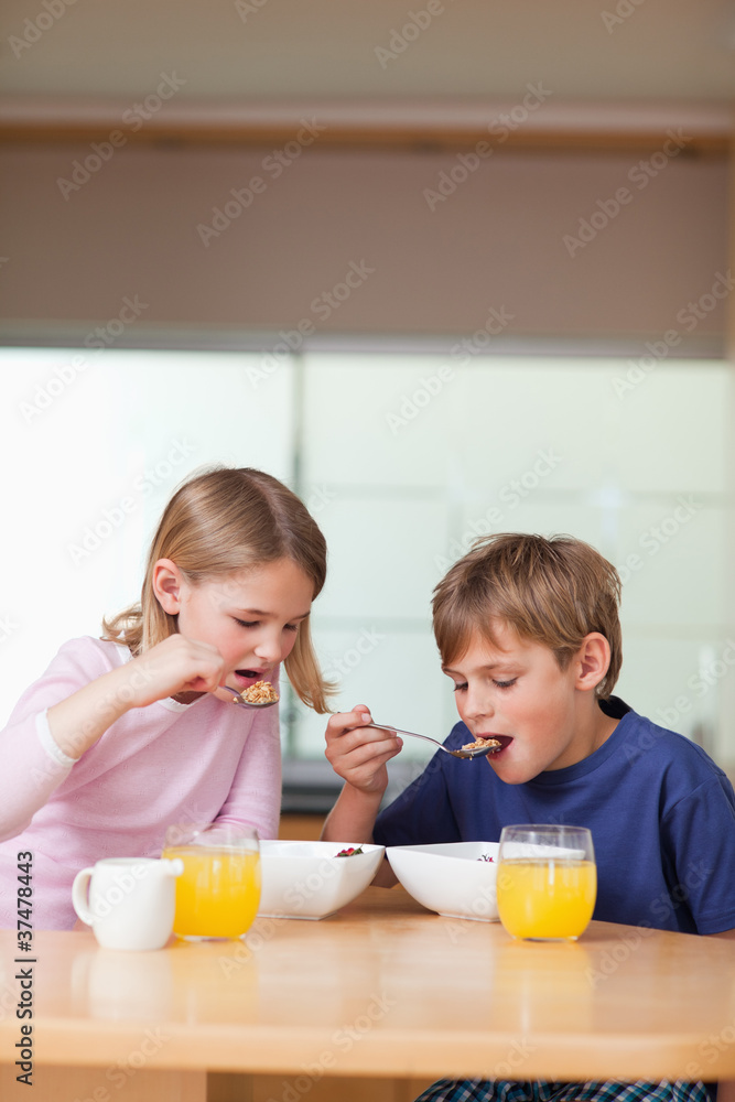 Portrait of children having breakfast Portrait of children having breakfast
