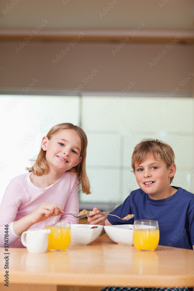 Portrait of young children having breakfast Portrait of young children having breakfast