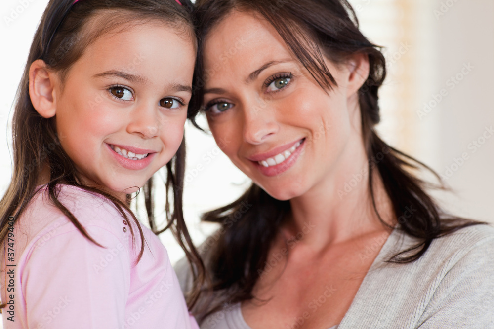 Close up of a girl and her mother Close up of a girl and her mother