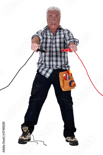 Schilderij op canvas Technician being electrocuted