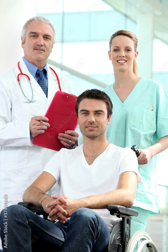 Fototapeta premium Doctor and nurse with patient in wheelchair