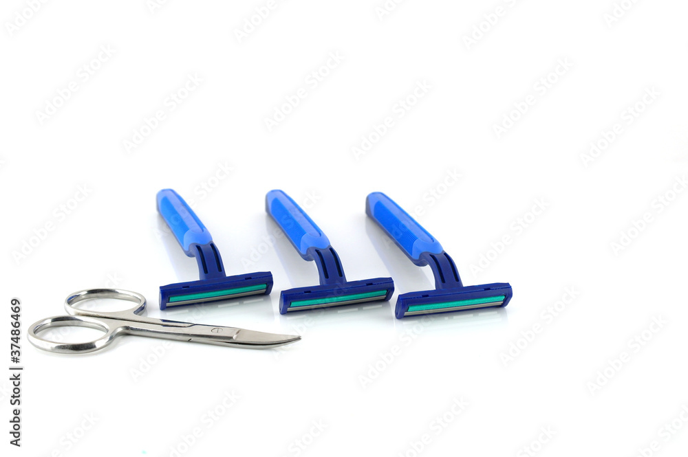 Three blue razors and scissors over white Three blue razors and scissors over white