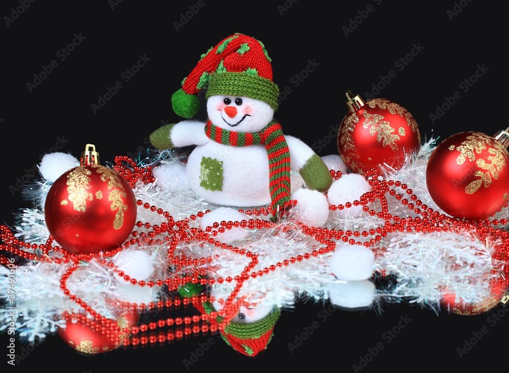 Toy snowman with a red festive balls and decorations,