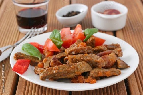 fried beef with sausages and carrot