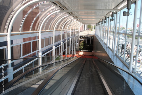 Фотография modern passenger conveyors, inclined moving walk