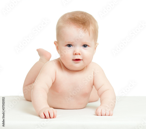 funny baby boy lying on tum...