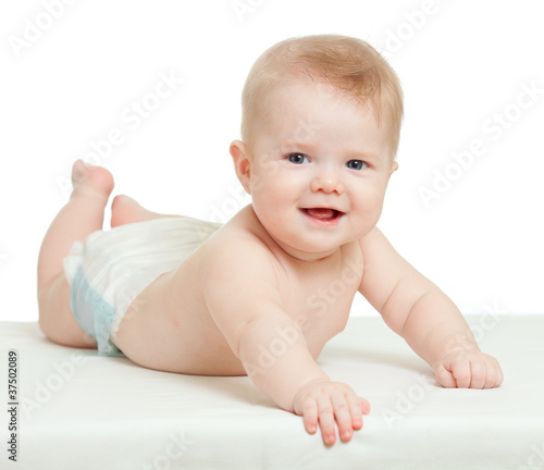 funny baby boy lying on tum...