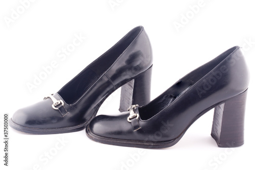 a pair of black heel shoes