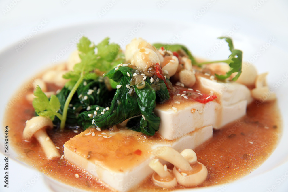 Chinese tofu with xo sauce and mushroom on white background Chinese tofu with xo sauce and mushroom on white background