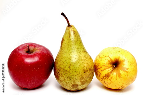 Juicy apples and pears closeup on white background