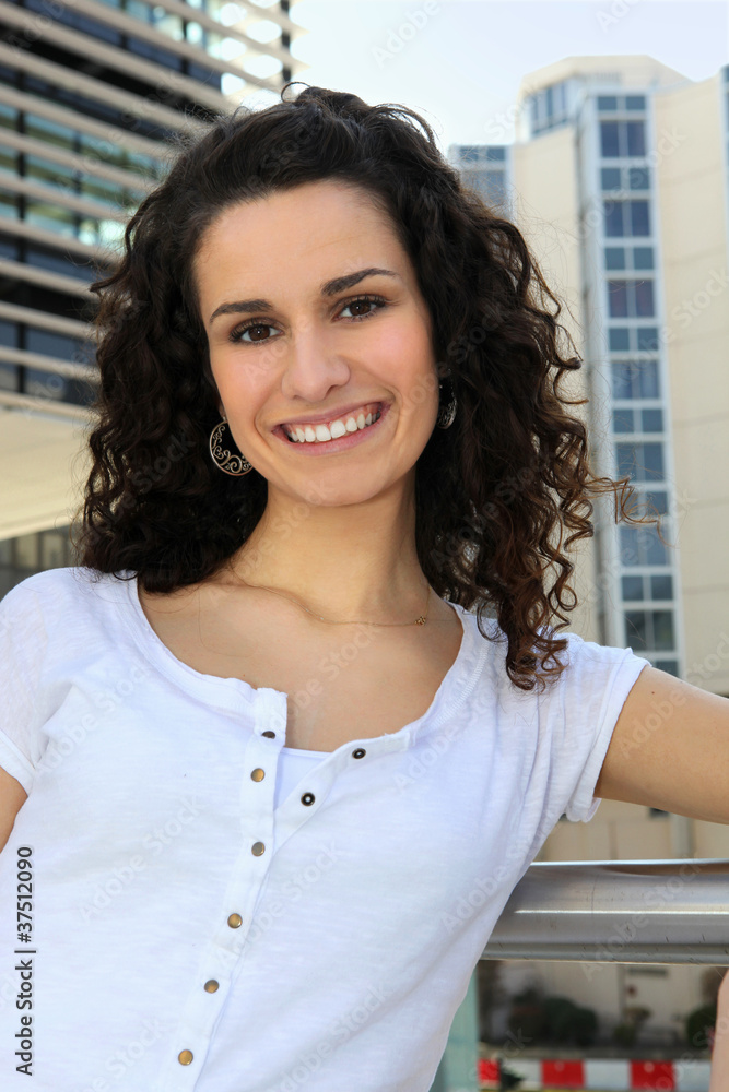 Portrait of a woman standing on a balcony Portrait of a woman standing on a balcony