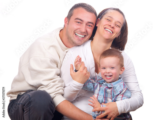 Happy young family isolated on white background