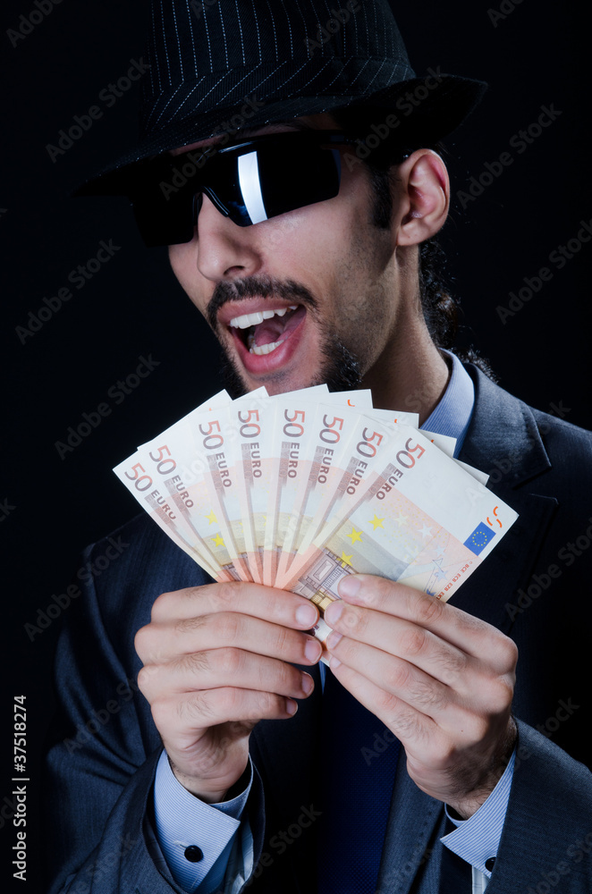 Man with counterfeir money Man with counterfeir money