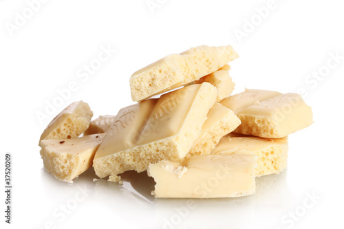Slices of white chocolate bar isolated on white