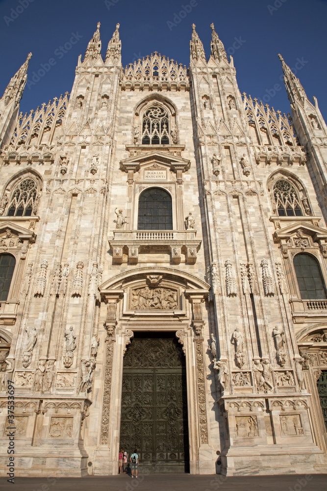 Milan - westfacade of cathedral in evening light