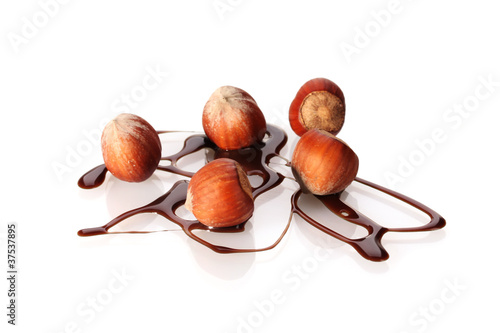 delicious hazelnut and chocolate syrup isolated on white © Africa Studio