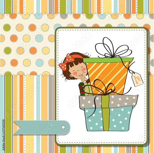 cute little girl hidden behind boxes of gifts
