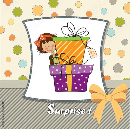cute little girl hidden behind boxes of gifts