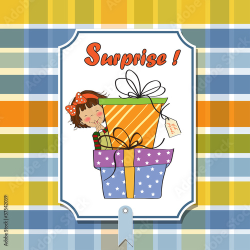 cute little girl hidden behind boxes of gifts