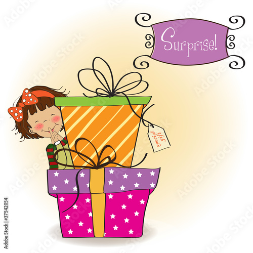 cute little girl hidden behind boxes of gifts