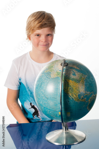 Boy studying globe