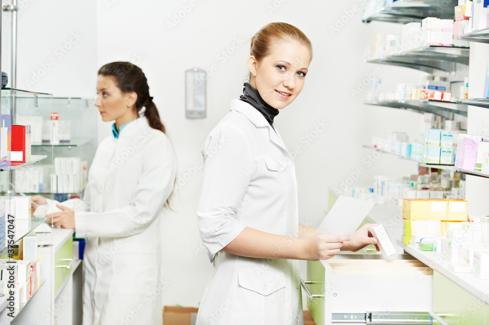 Obraz premium Pharmacy chemist women in drugstore