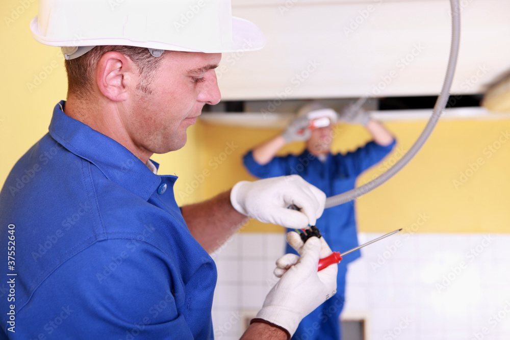 Two electrical engineers working Two electrical engineers working