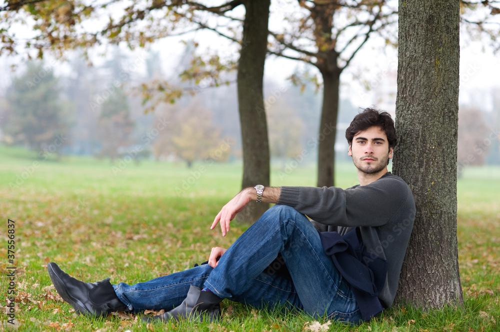 Relaxed man outdoor. Intense portrait.