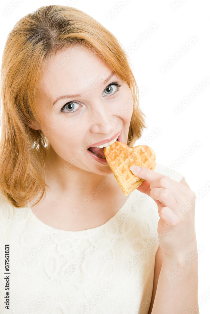 Woman eating cookies in a heart-shaped. Woman eating cookies in a heart-shaped.